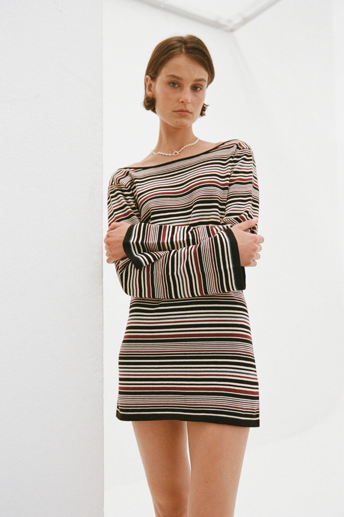 Long sleeve striped mini dress with fitted silhouette and flared cuffs in neutral tones