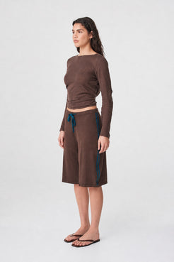 Tully Shorts in Espresso & Teal three-quarter side view highlighting the relaxed shape and teal stripes through the hip and leg.