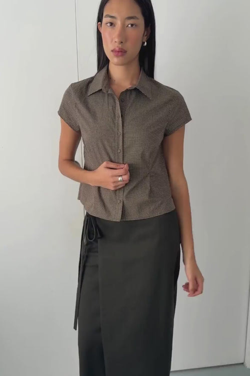 video against white background of model wearing Freya shirt in chocolate check